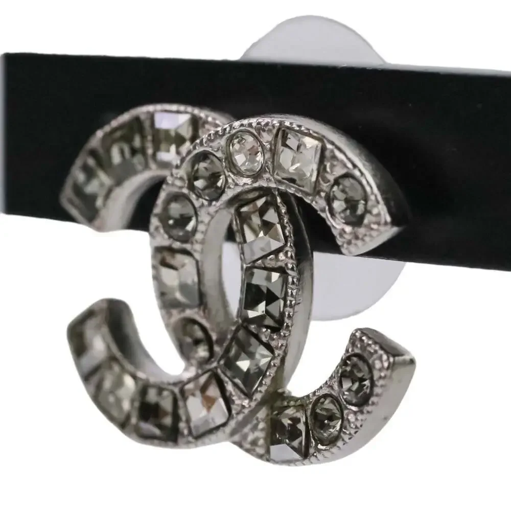 CHANEL Silver Logo Earrings
